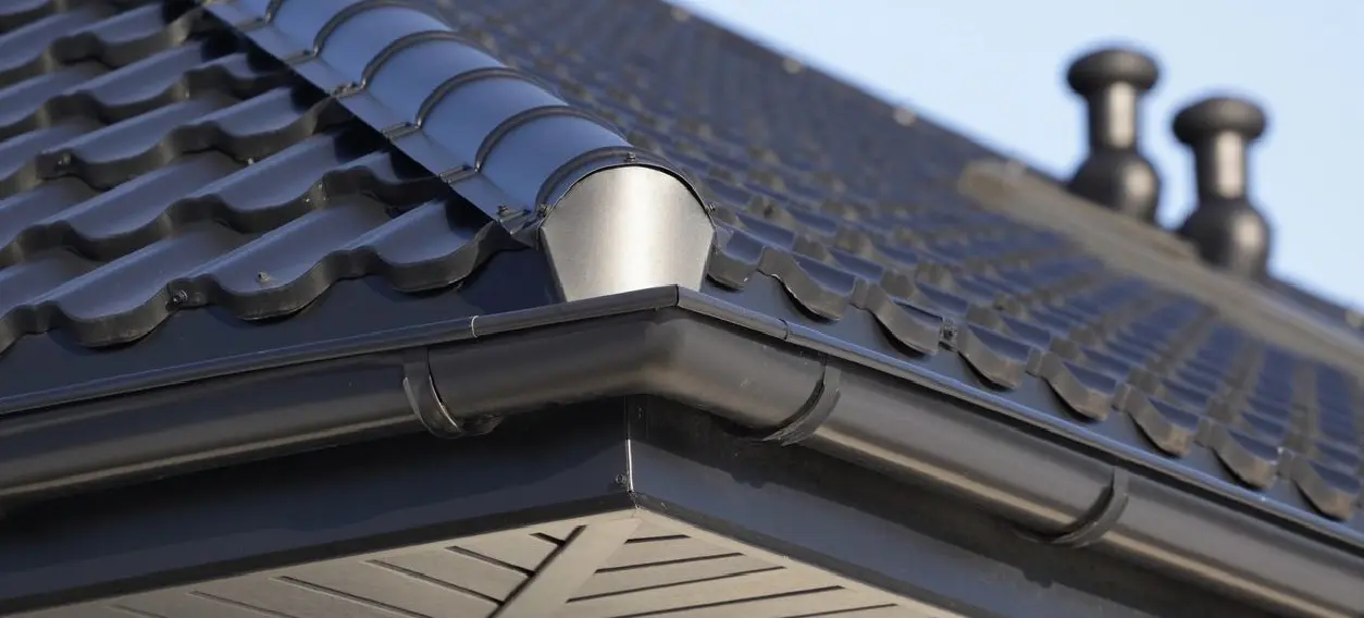 A close up of the gutter on a roof